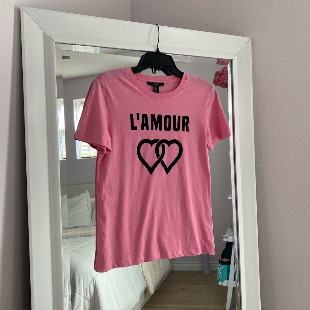 Forever 21 pink top with graphic detail. NWOT. Size small.